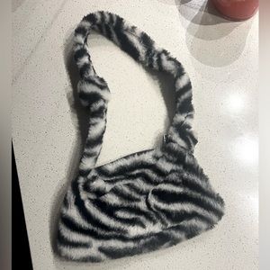 Black zebra print fuzzy purse